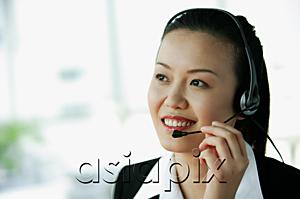 AsiaPix - Woman wearing headset, smiling