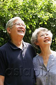 AsiaPix - Senior couple looking up, smiling
