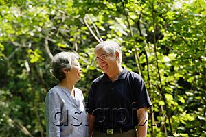 AsiaPix - Mature couple, standing side by side, smiling, portrait