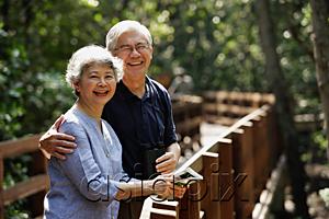 AsiaPix - Mature couple side by side, smiling, looking at camera