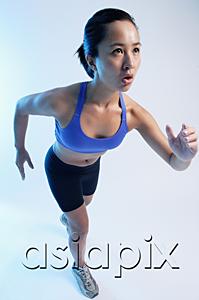 AsiaPix - Woman in running position, high angle view