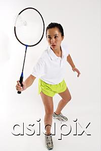 AsiaPix - Woman hitting shuttlecock with badminton racket