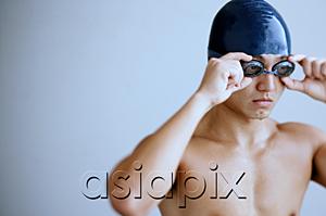 AsiaPix - Man with swimming cap, adjusting goggles