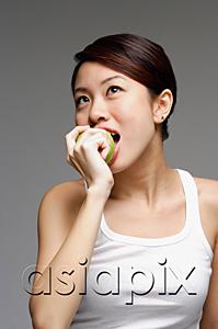 AsiaPix - Woman biting into apple