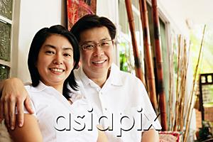 AsiaPix - Husband and wife looking at camera, portrait