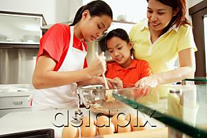 AsiaPix - Mother and two daughters in kitchen