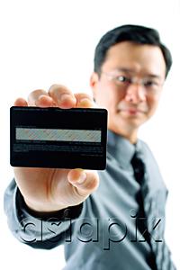 AsiaPix - Businessman holding credit card