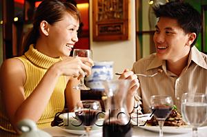 AsiaPix - Couple dining in restaurant
