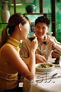 AsiaPix - Couple dining in Chinese restaurant, drinking wine