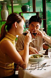 AsiaPix - Couple in Chinese restaurant, drinking wine