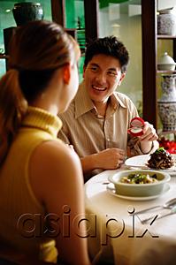 AsiaPix - Man proposing to woman at restaurant