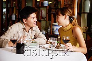 AsiaPix - Couple dining in restaurant, sitting face to face