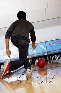 AsiaPix - Man bowling in bowling alley