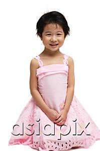 AsiaPix - Young girl in pink dress, looking at camera