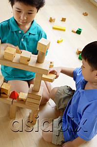 AsiaPix - Children playing with building blocks, high angle view