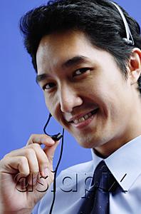 AsiaPix - Man wearing headset, looking at camera, smiling