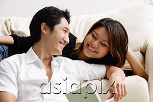 AsiaPix - Couple looking at each other, man holding book