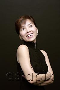 AsiaPix - Woman with arms crossed, smiling, looking up