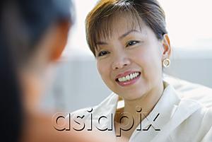 AsiaPix - Woman smiling, focus on the background