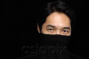 AsiaPix - Man with turtleneck over face, looking at camera