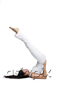 AsiaPix - Woman doing yoga, shoulder stand position