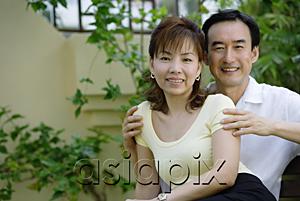 AsiaPix - Mature couple sitting together, smiling