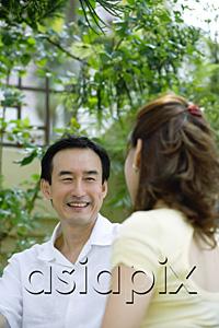 AsiaPix - Husband looking at wife, smiling