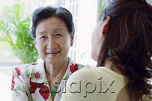 AsiaPix - Woman with adult daughter, over the shoulder view