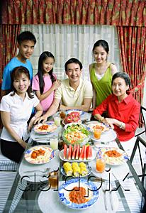 AsiaPix - Three generation family around dining table, portrait