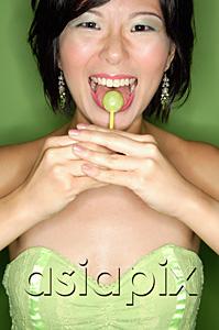 AsiaPix - Woman eating lollipop