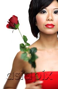 AsiaPix - Woman holding single stalk of rose