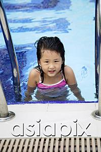AsiaPix - Girl in swimming pool, looking at camera