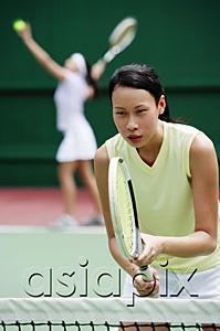 AsiaPix - Woman holding tennis racket
