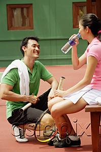 AsiaPix - Couple at tennis court, drinking water