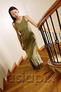 AsiaPix - Woman on staircase, looking at camera