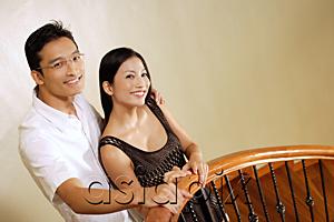 AsiaPix - Couple standing at staircase, smiling