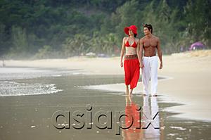 AsiaPix - Couple walking along beach, holding hands