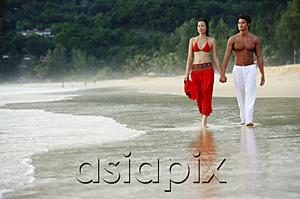 AsiaPix - Couple walking side by side along beach, holding hands
