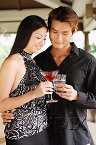 AsiaPix - Well dressed couple, holding drinks, toasting