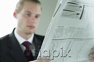 AsiaPix - Businessman with newspaper