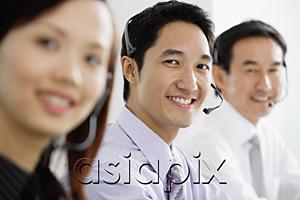 AsiaPix - Executives wearing headsets, smiling at camera