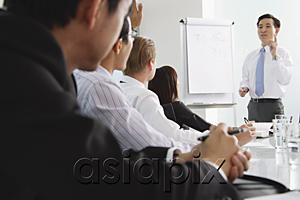 AsiaPix - Businessman presenting to other executives