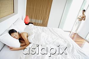 AsiaPix - Woman in bedroom, sleeping, man standing at doorway, holding tray
