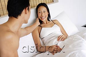AsiaPix - Couple in bed, man touching womans face