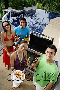 AsiaPix - Couples at barbeque party, smiling at camera, portrait