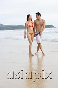 AsiaPix - Couple walking on beach, holding hands