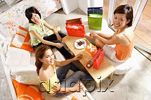 AsiaPix - Young women at home, celebrating birthday, looking up at camera