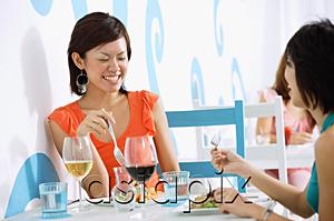 AsiaPix - Young women having lunch in cafe