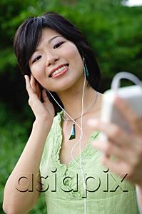 AsiaPix - Young woman with mp3 player
