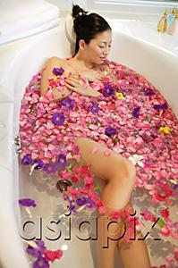 AsiaPix - Woman in bathtub, surrounded by flowers